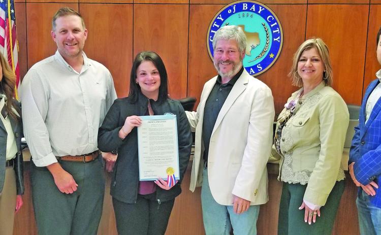 Sentinel photo/Mike Reddell A City Council proclamation last week designated the month of May as National Preservation Month. Main Street Director Tina Israel displays the document.
