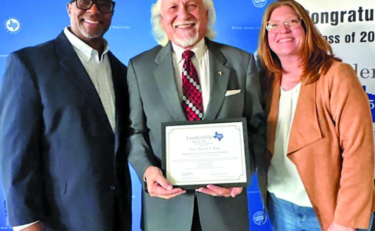 Contributed photo Attached photo includes, from left: Guest speaker Dallas County Clerk John Warren, Matagorda County District Attorney Steven Reis, and Director of Education & Member Services Haley Click.