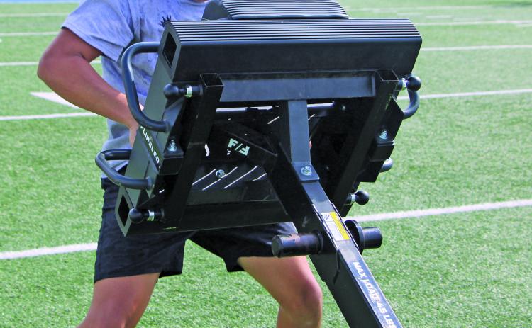 Sentinel Photo/Mike Reddell A Bay City Blackcat wrestles a lift downfield as another measure of upper and lower body strength.