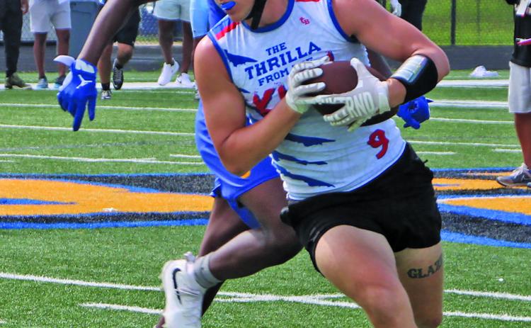 A Tidehaven runner tries to outdistance his Bay City defender in a 7on7 matchup last week during BCISD’s Kings of the South 7on7, Linemen Challenge last week at Memorial Stadium.  Sentinel Photo/Mike Reddell