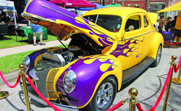 Sentinel Photo/Mike Reddell Hotel Blessing Day drew an impressive crowd Saturday, July 18, with a car show, music, vendors, food and the historic hotel itself. Above is this classic hot rod, a 1940 Ford coupe, which was one of many cars on display.