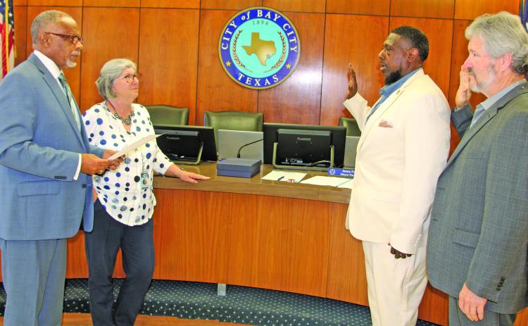 Sentinel Photo/Mike Reddell Shown from left, Bay City Mayor Robert Nelson, City Secretary Jeanna Thompson, and councilmen Corey McCray, and Jim Folse take part in swearing in ceremony last week.