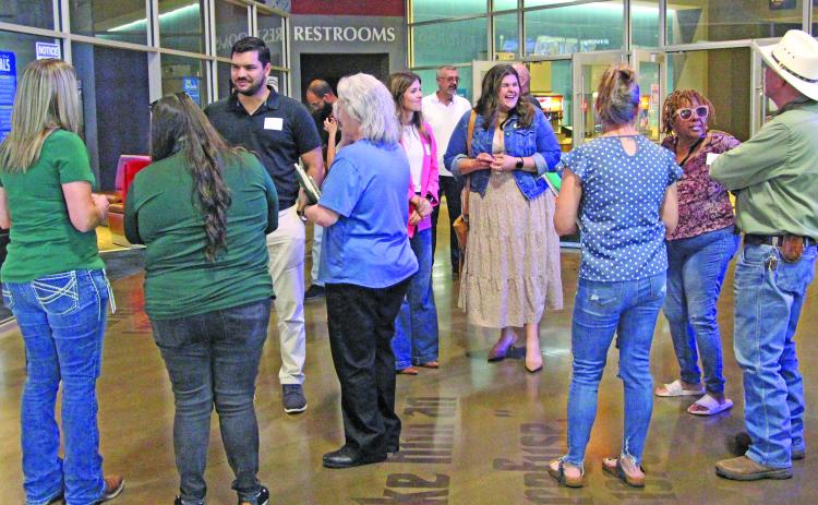 Sentinel Photo/Jessica Shepard Several business professionals take the time to network before Lynn Engineering's "How to Never Fail a Windstorm Inspection" luncheon on Wednesday, July 1.