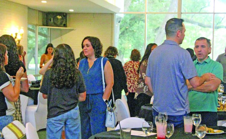 Sentinel Photo/Jessica Shepard Members of the Youth Leadership Matagorda County mingle with school and business leaders during a luncheon last week.