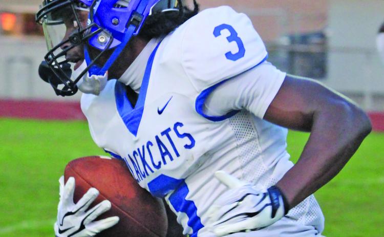 Blackcat punt returner Bradon Jones (3) breaks upfield against Furr last Thursday. Jones had 125 yards on three returns. Sentinel Photo Mike Reddell